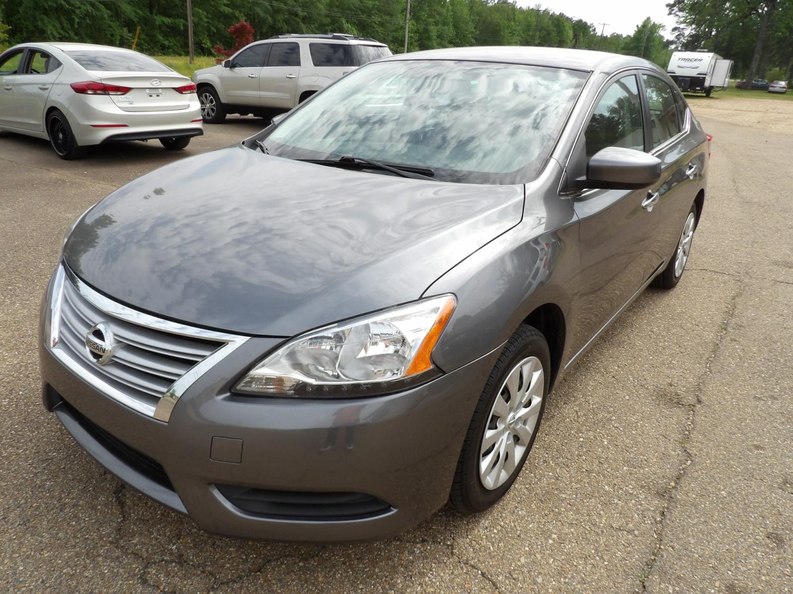 2015 Brilliant Silver /Black Nissan Sentra S 6MT (3N1AB7APXFY) with an 1.8L L4 SFI DOHC 16V engine, 6-Speed automatic transmission, located at 401 First NE, Bearden, AR, 71720, (870) 687-3414, 33.726528, -92.611519 - Photo #0