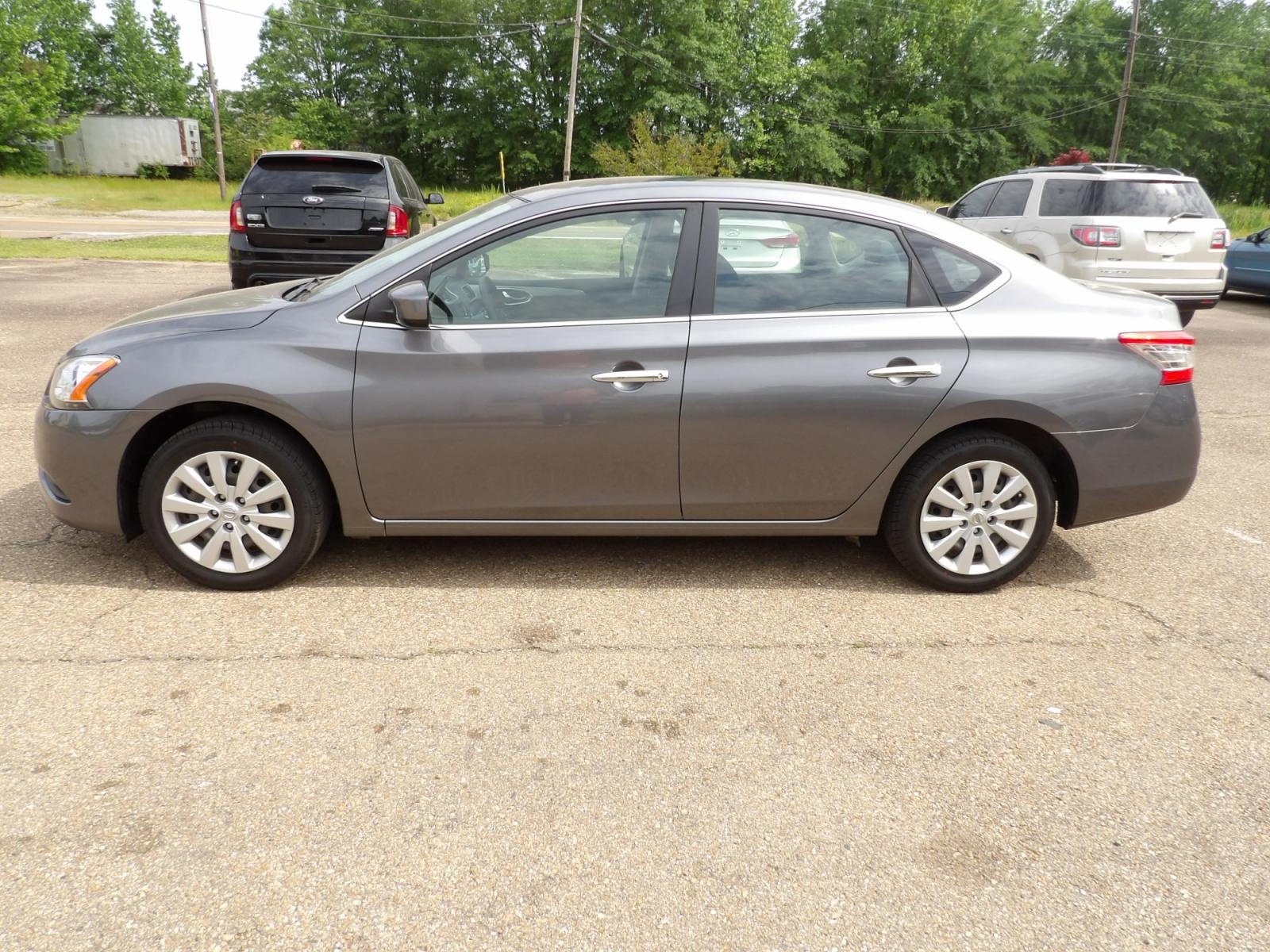 2015 Brilliant Silver /Black Nissan Sentra S 6MT (3N1AB7APXFY) with an 1.8L L4 SFI DOHC 16V engine, 6-Speed automatic transmission, located at 401 First NE, Bearden, AR, 71720, (870) 687-3414, 33.726528, -92.611519 - Photo #1