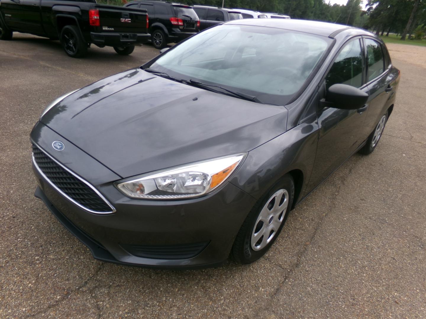 2015 Magnetic Metallic /Charcoal Ford Focus S (1FADP3E23FL) with an 2.0L engine, Automatic transmission, located at 401 First NE, Bearden, AR, 71720, (870) 687-3414, 33.726528, -92.611519 - Photo#0