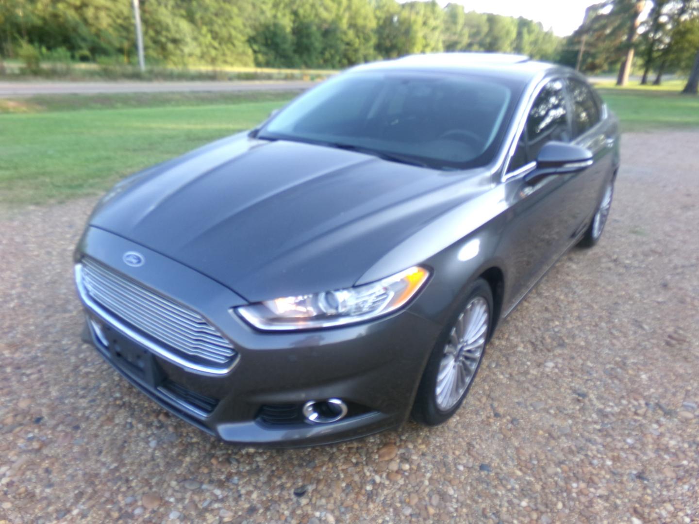 2015 Magnetic Metallic /Black Ford Fusion Titanium (3FA6P0K97FR) with an 2.5L Ecoboost engine, automatic transmission, located at 401 First NE, Bearden, AR, 71720, (870) 687-3414, 33.726528, -92.611519 - Photo#0