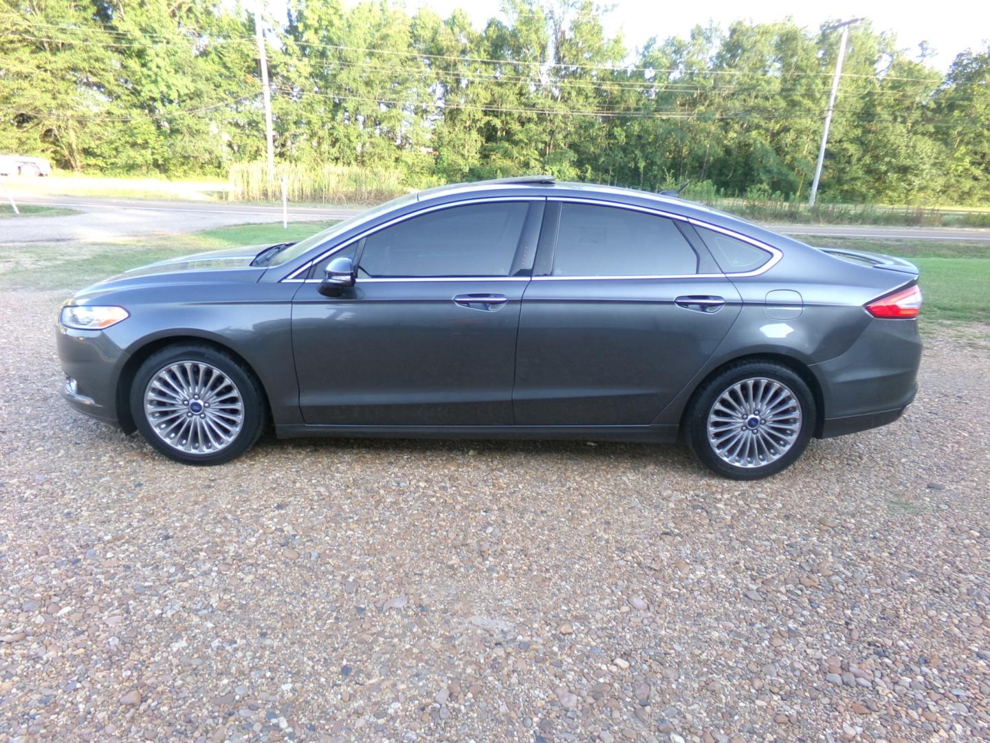 2015 Magnetic Metallic /Black Ford Fusion Titanium (3FA6P0K97FR) with an 2.5L Ecoboost engine, automatic transmission, located at 401 First NE, Bearden, AR, 71720, (870) 687-3414, 33.726528, -92.611519 - Photo#1