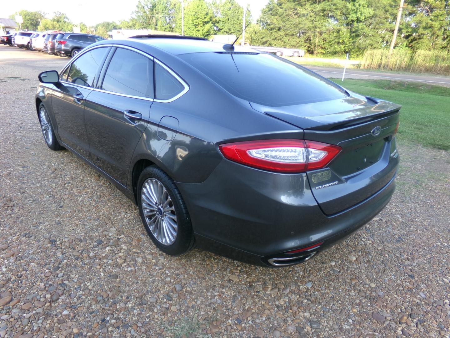 2015 Magnetic Metallic /Black Ford Fusion Titanium (3FA6P0K97FR) with an 2.5L Ecoboost engine, automatic transmission, located at 401 First NE, Bearden, AR, 71720, (870) 687-3414, 33.726528, -92.611519 - Photo#2