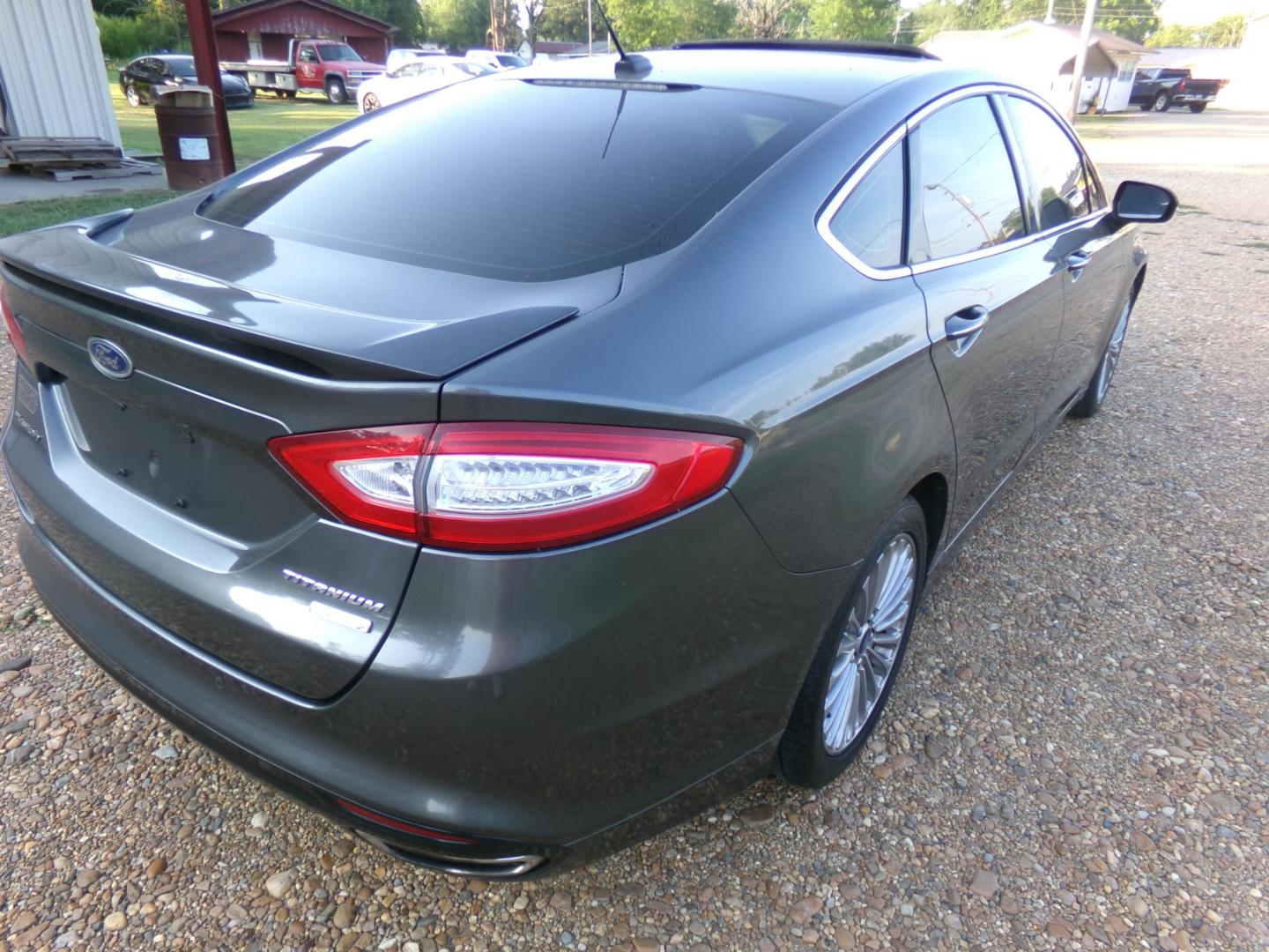 2015 Magnetic Metallic /Black Ford Fusion Titanium (3FA6P0K97FR) with an 2.5L Ecoboost engine, automatic transmission, located at 401 First NE, Bearden, AR, 71720, (870) 687-3414, 33.726528, -92.611519 - Photo#22