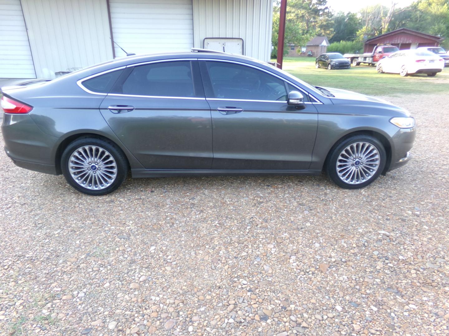 2015 Magnetic Metallic /Black Ford Fusion Titanium (3FA6P0K97FR) with an 2.5L Ecoboost engine, automatic transmission, located at 401 First NE, Bearden, AR, 71720, (870) 687-3414, 33.726528, -92.611519 - Photo#23