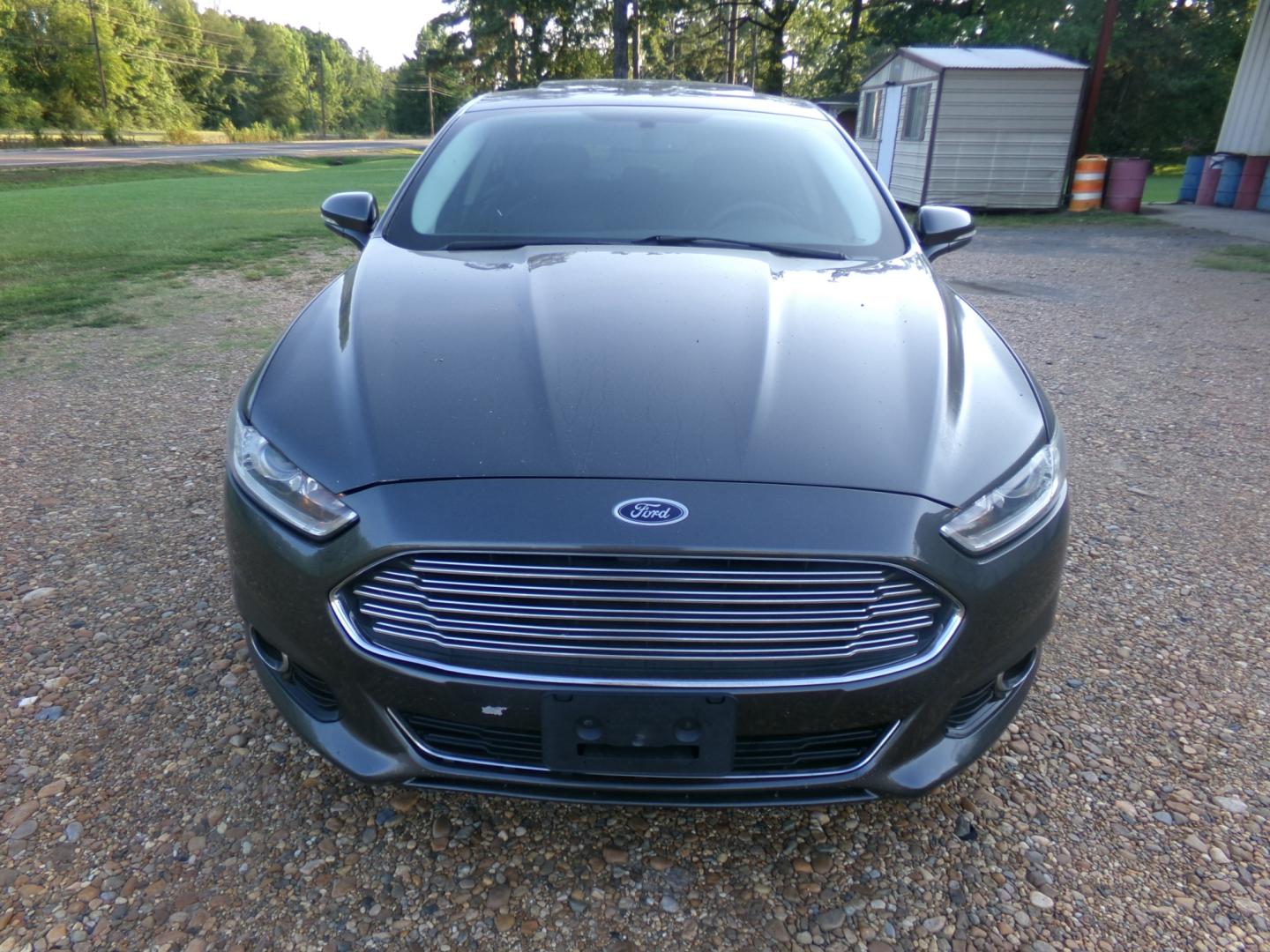 2015 Magnetic Metallic /Black Ford Fusion Titanium (3FA6P0K97FR) with an 2.5L Ecoboost engine, automatic transmission, located at 401 First NE, Bearden, AR, 71720, (870) 687-3414, 33.726528, -92.611519 - Photo#24