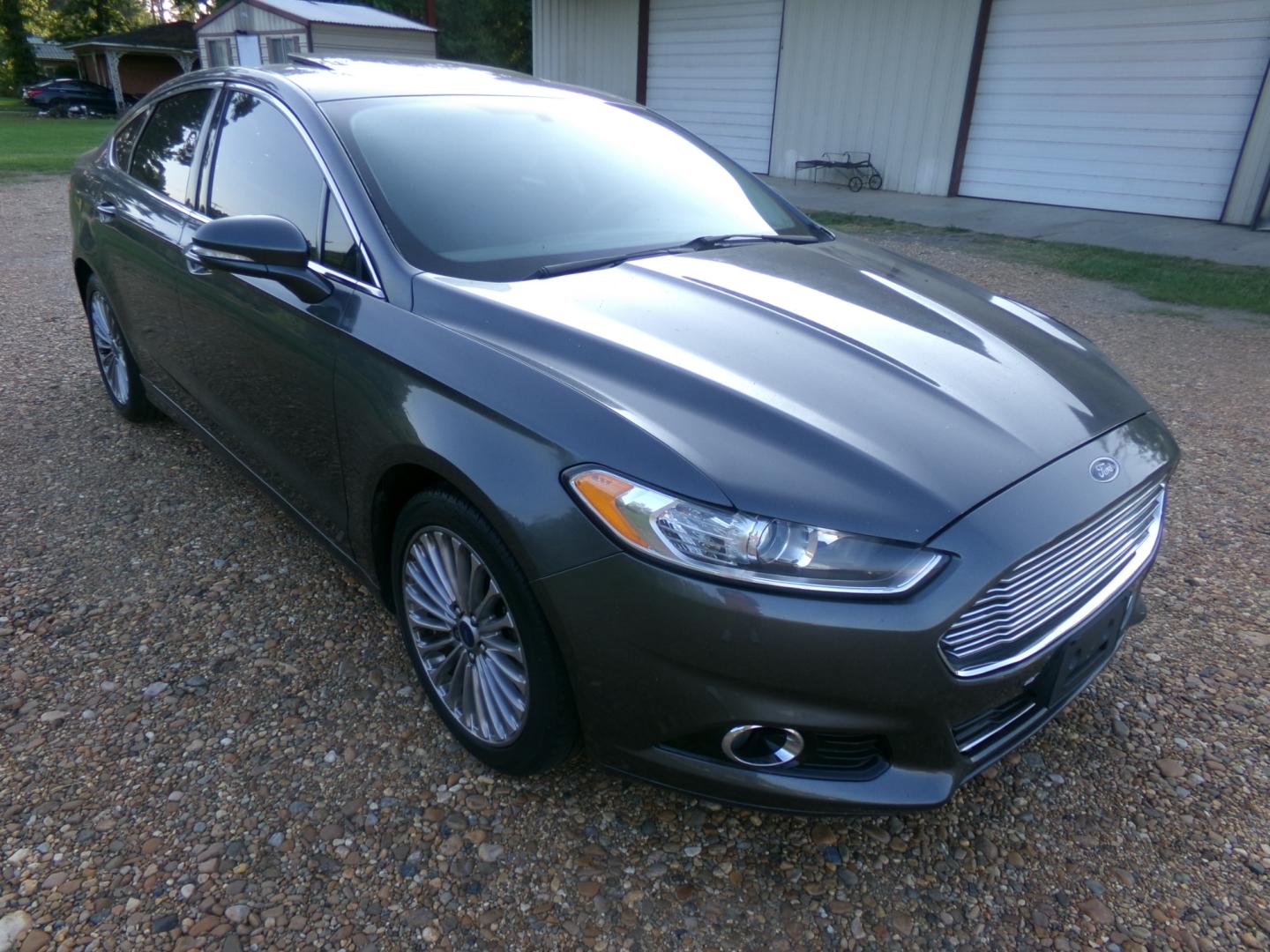 2015 Magnetic Metallic /Black Ford Fusion Titanium (3FA6P0K97FR) with an 2.5L Ecoboost engine, automatic transmission, located at 401 First NE, Bearden, AR, 71720, (870) 687-3414, 33.726528, -92.611519 - Photo#25