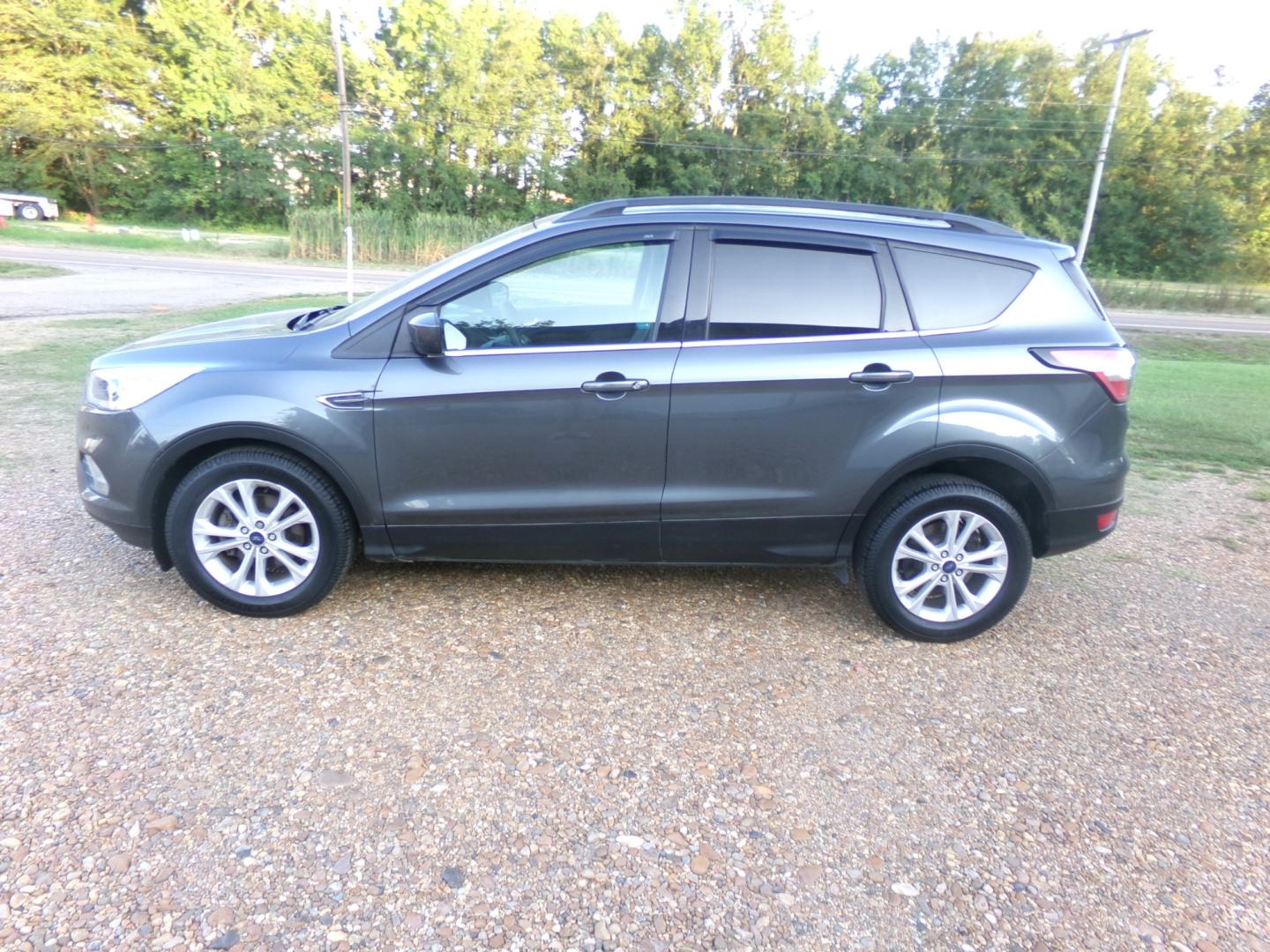 2017 Sterling Gray Metallic /Gray Ford Escape SE (1FMCU0GD6HU) with an 1.6L Ecoboost engine, automatic transmission, located at 401 First NE, Bearden, AR, 71720, (870) 687-3414, 33.726528, -92.611519 - Photo#1