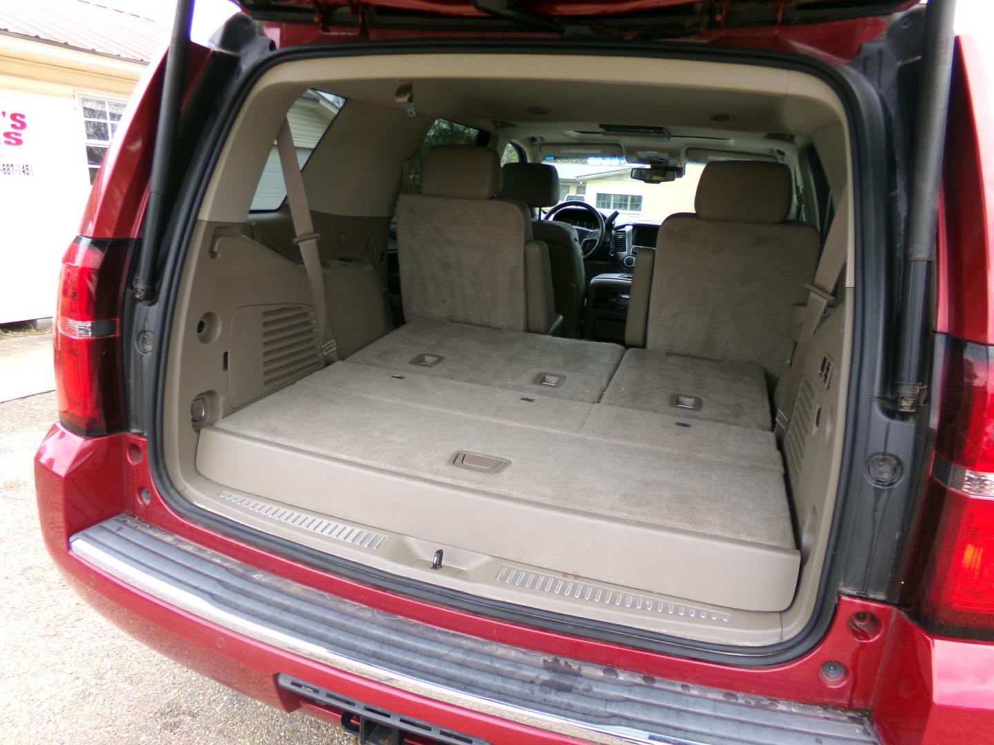 2015 Crystal Red Tintcoat /Tan Chevrolet Tahoe LTZ 4WD (1GNSKCKC1FR) with an 5.3L V8 OHV 16V engine, 6-Speed Automatic transmission, located at 401 First NE, Bearden, AR, 71720, (870) 687-3414, 33.726528, -92.611519 - Photo#5