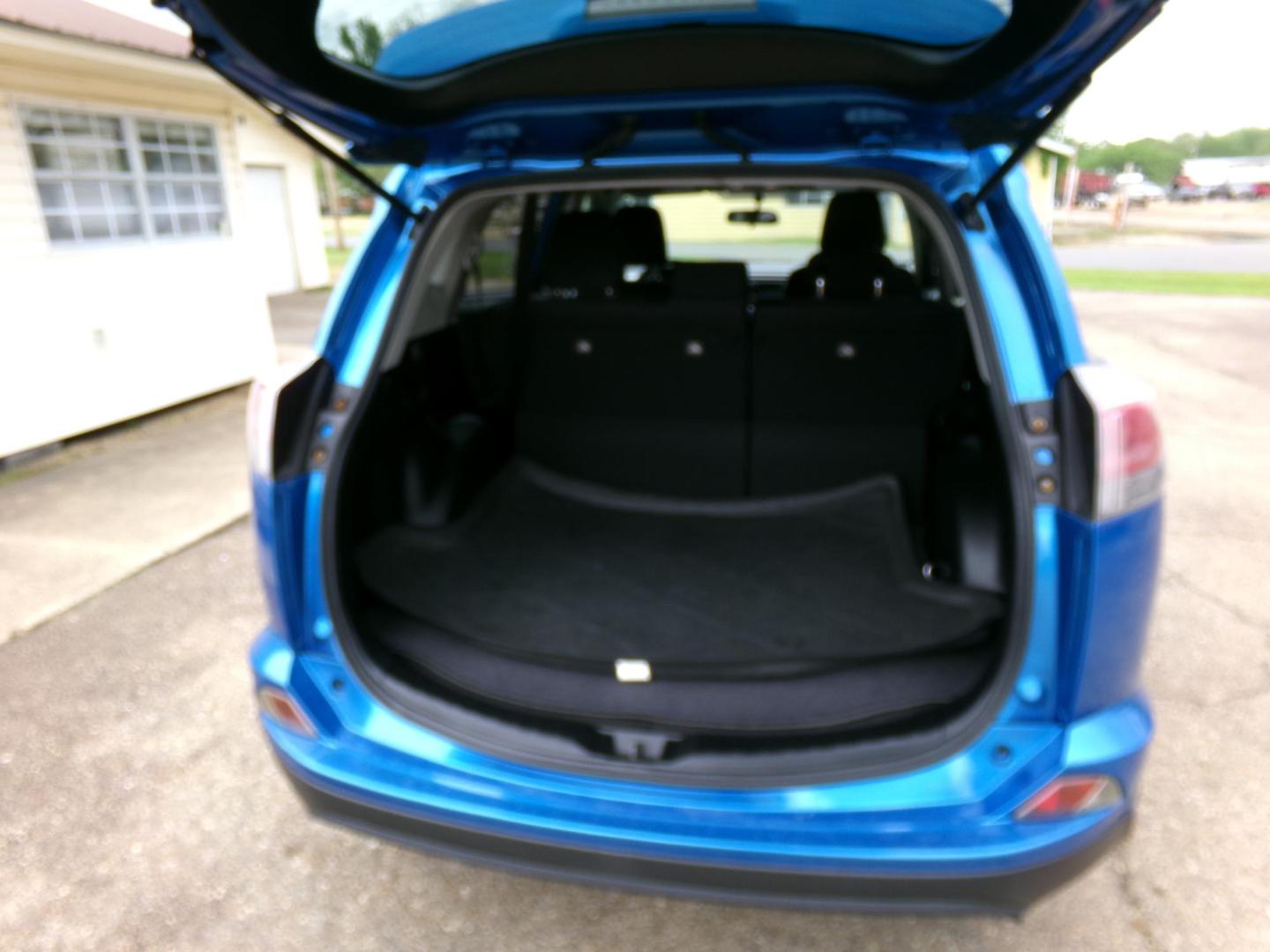 2016 Electric Storm Blue /Charcoal Toyota RAV4 LE FWD (JTMZFREV1GJ) with an 2.5L L4 DOHC 16V engine, 6-speed automatic transmission, located at 401 First NE, Bearden, AR, 71720, (870) 687-3414, 33.726528, -92.611519 - Photo#3
