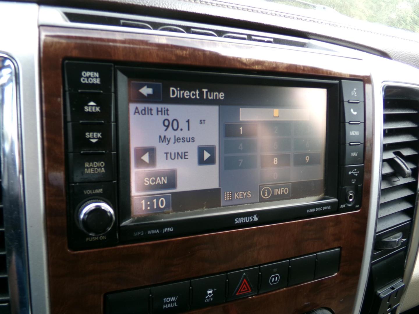 2012 Sarsaparilla Sage Metallic /Tan Dodge Ram 1500 Laramie Quad Cab 2WD (1C6RD6JT1CS) with an 5.7L V8 OHV 16V engine, 6-Speed Automatic transmission, located at 401 First NE, Bearden, AR, 71720, (870) 687-3414, 33.726528, -92.611519 - Photo#12