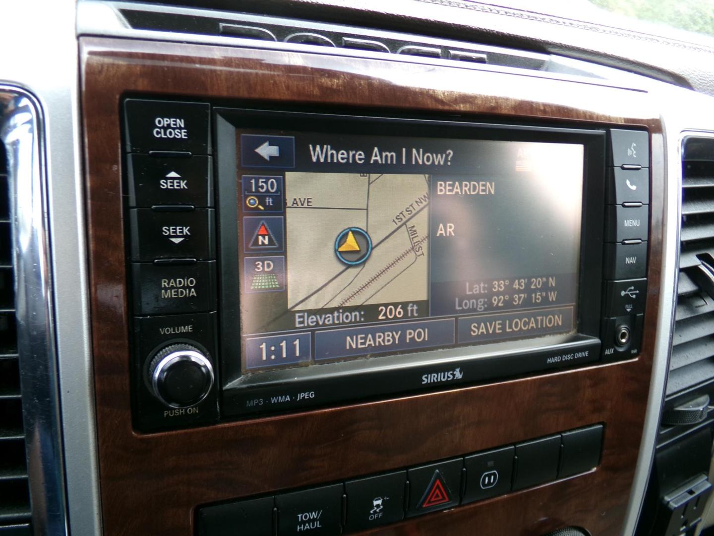 2012 Sarsaparilla Sage Metallic /Tan Dodge Ram 1500 Laramie Quad Cab 2WD (1C6RD6JT1CS) with an 5.7L V8 OHV 16V engine, 6-Speed Automatic transmission, located at 401 First NE, Bearden, AR, 71720, (870) 687-3414, 33.726528, -92.611519 - Photo#14