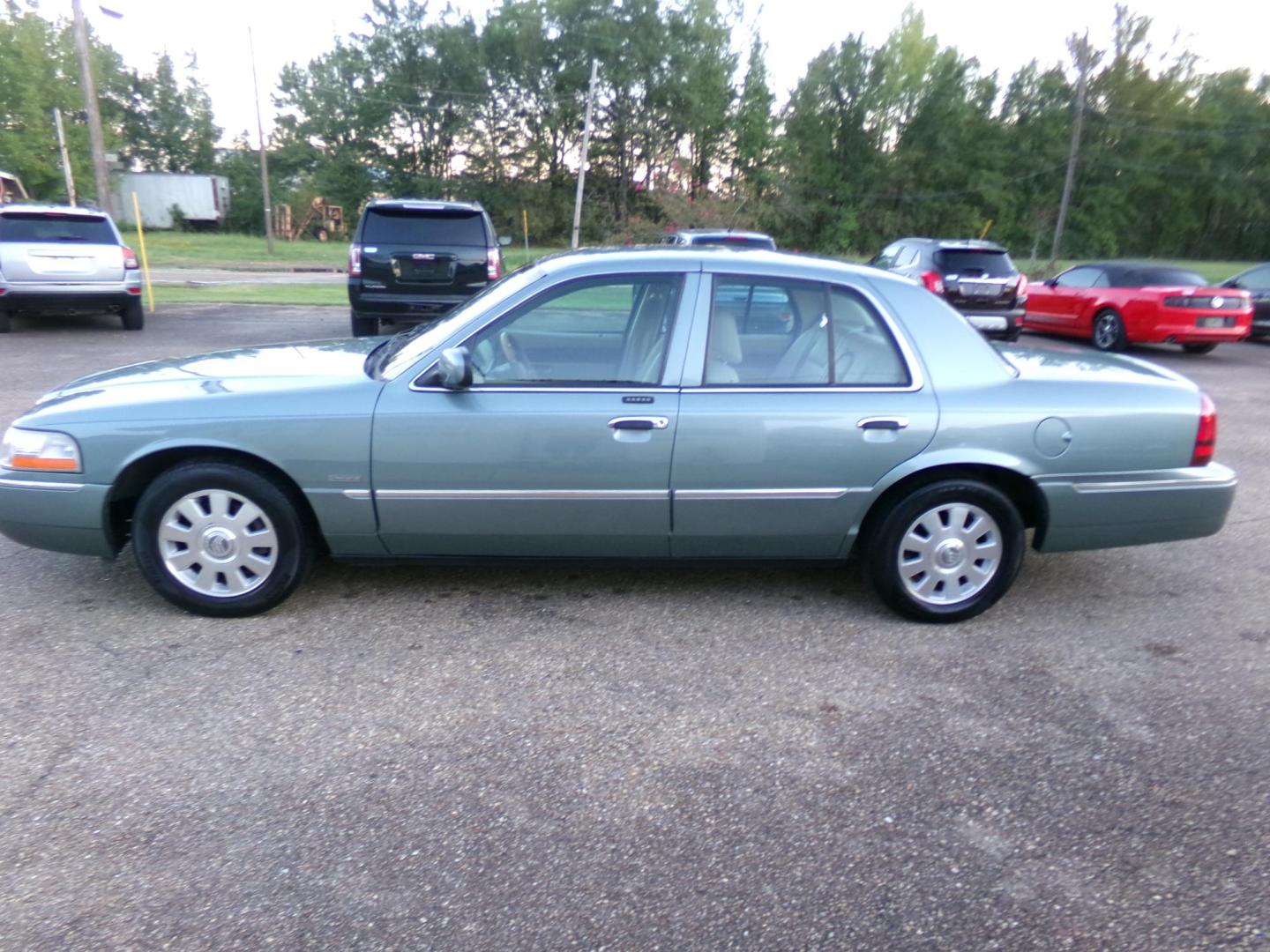 2005 Light Tundra Metallic /Tan Mercury Grand Marquis LS Premium (2MEHM75W25X) with an 4.6L V8 OHC 16V engine, 4-Speed Automatic Overdrive transmission, located at 401 First NE, Bearden, AR, 71720, (870) 687-3414, 33.726528, -92.611519 - Photo#1