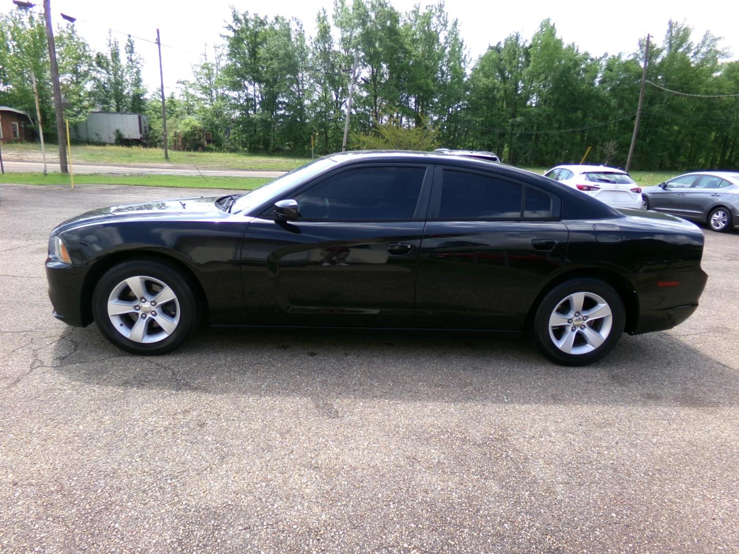2014 Black /Black Dodge Charger SE (2C3CDXBG2EH) with an 3.6L V6 DOHC 24V engine, 5-Speed Automatic transmission, located at 400 First NW, Bearden, AR, 71720, (870) 687-3414, 0.000000, 0.000000 - Photo#1