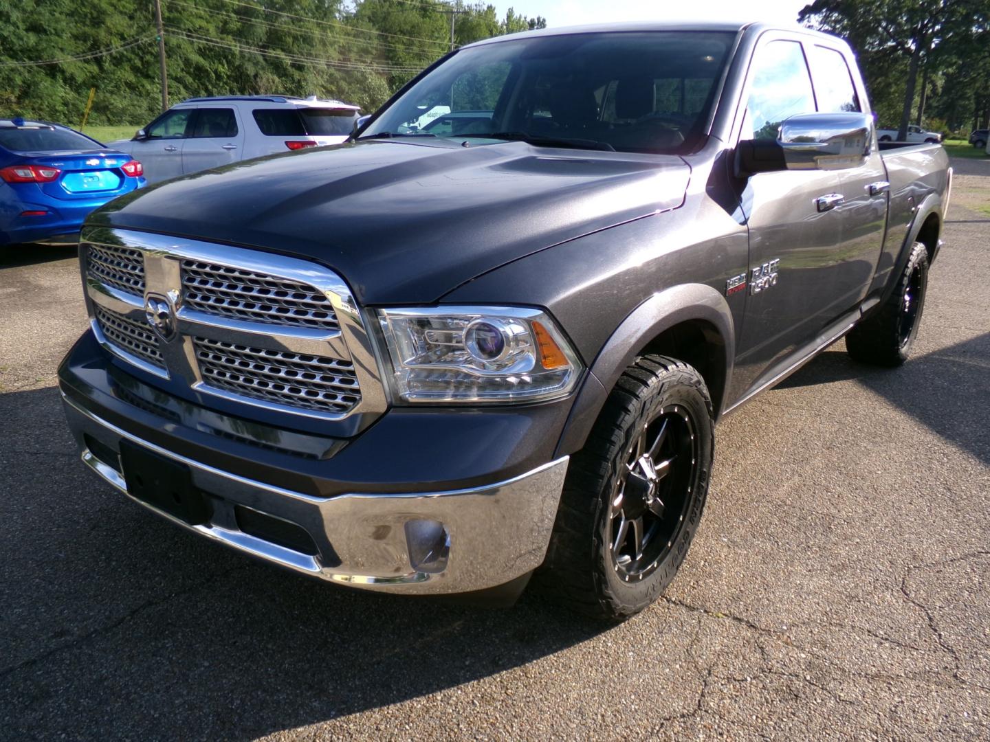 2018 Granite Crystal Metallic /Black RAM 1500 Laramie Quad Cab 2WD (1C6RR6JTXJS) with an 5.7L V8 OHV 16V engine, 8-speed automatic transmission, located at 400 First NW, Bearden, AR, 71720, (870) 687-3414, 0.000000, 0.000000- Photo#0