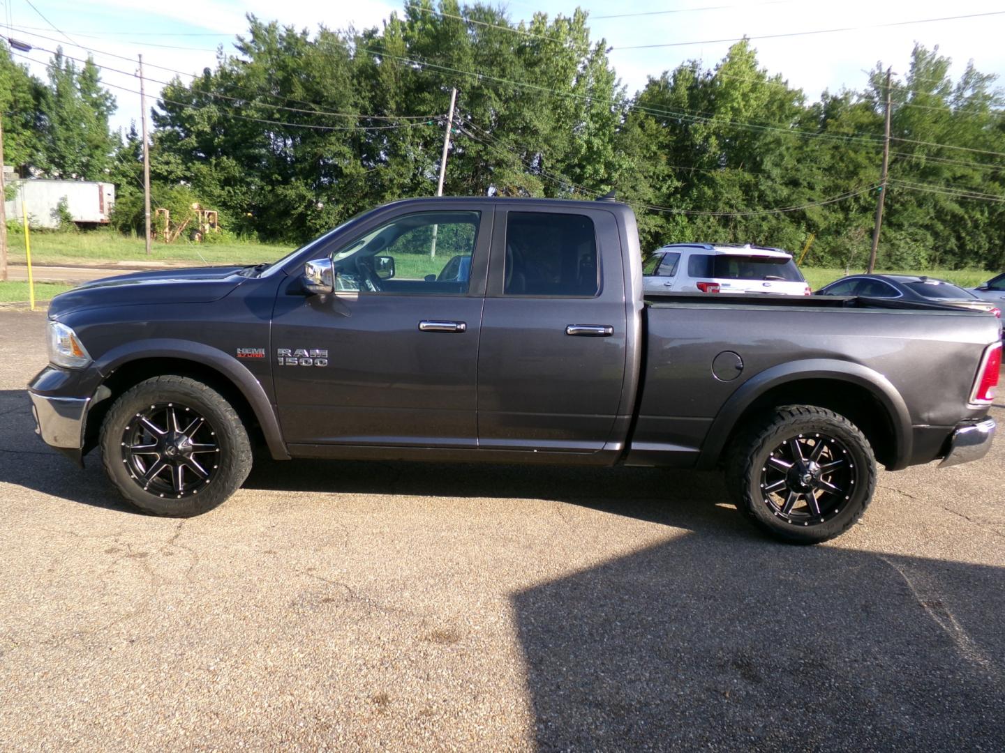 2018 Granite Crystal Metallic /Black RAM 1500 Laramie Quad Cab 2WD (1C6RR6JTXJS) with an 5.7L V8 OHV 16V engine, 8-speed automatic transmission, located at 400 First NW, Bearden, AR, 71720, (870) 687-3414, 0.000000, 0.000000- Photo#1