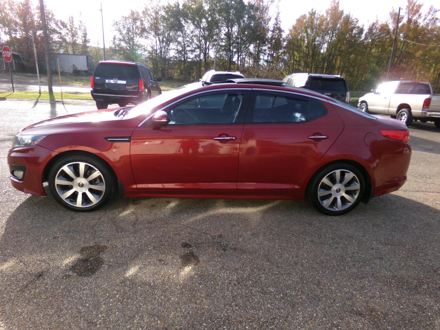 2011 Spicy Red Metallic /Black Kia Optima SX (KNAGR4A60B5) with an 2.4L L4 DOHC 16V TURBO engine, 6-Speed Automatic transmission, located at 401 First NE, Bearden, AR, 71720, (870) 687-3414, 33.726528, -92.611519 - Photo#1